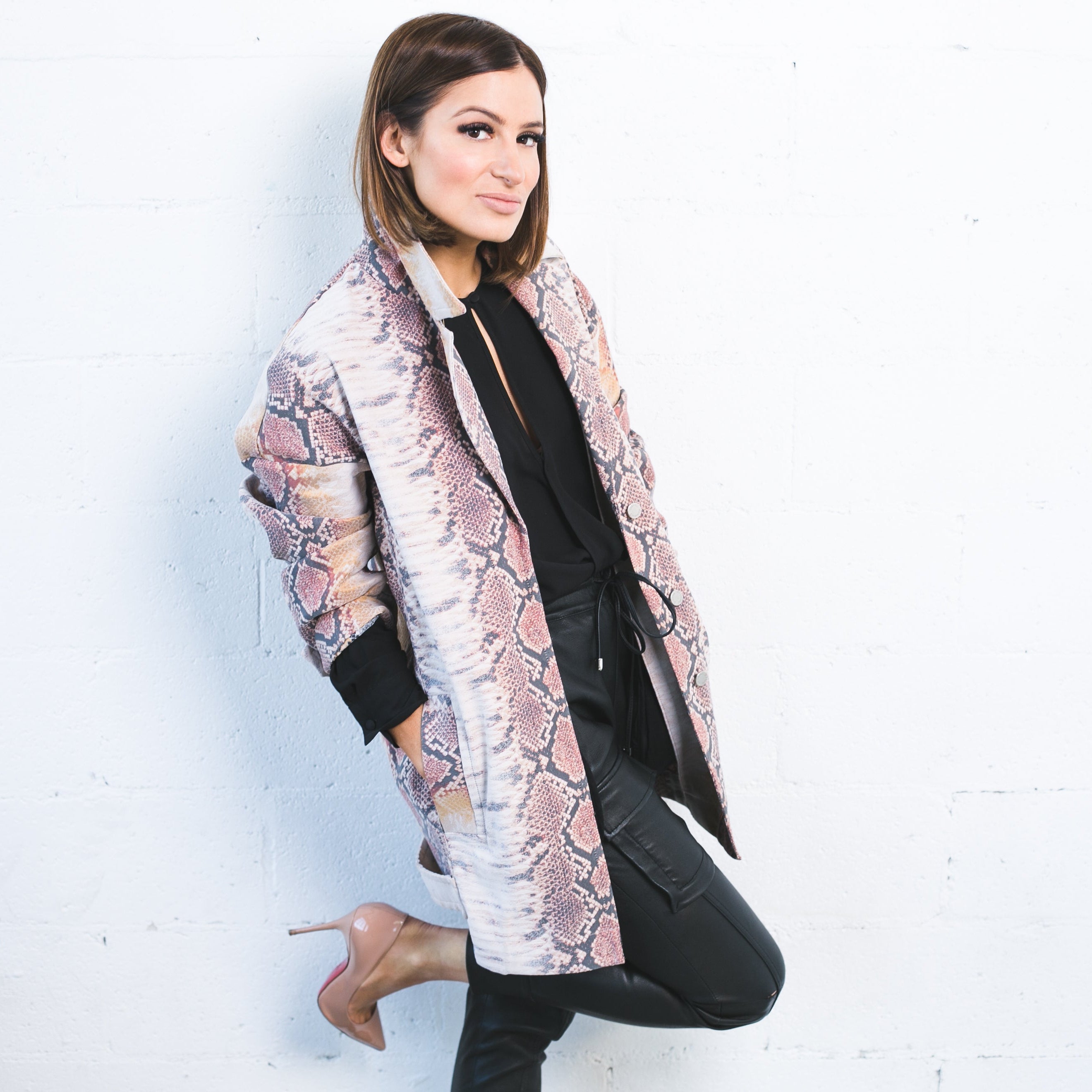 Professional portrait of a woman wearing handcrafted jewellery