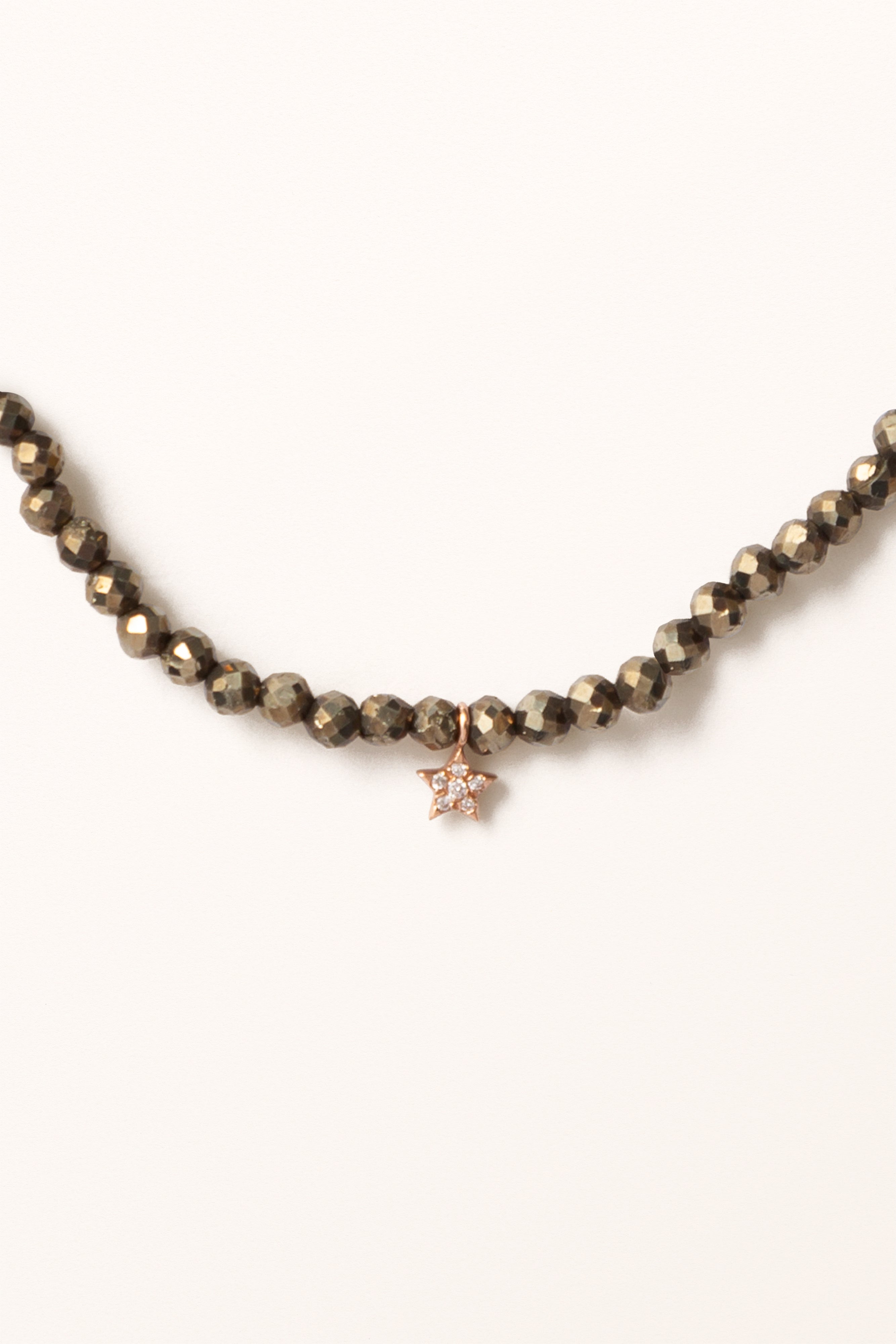 Polished gold open cuff with subtle curve from Melana B21-2 bracelet range