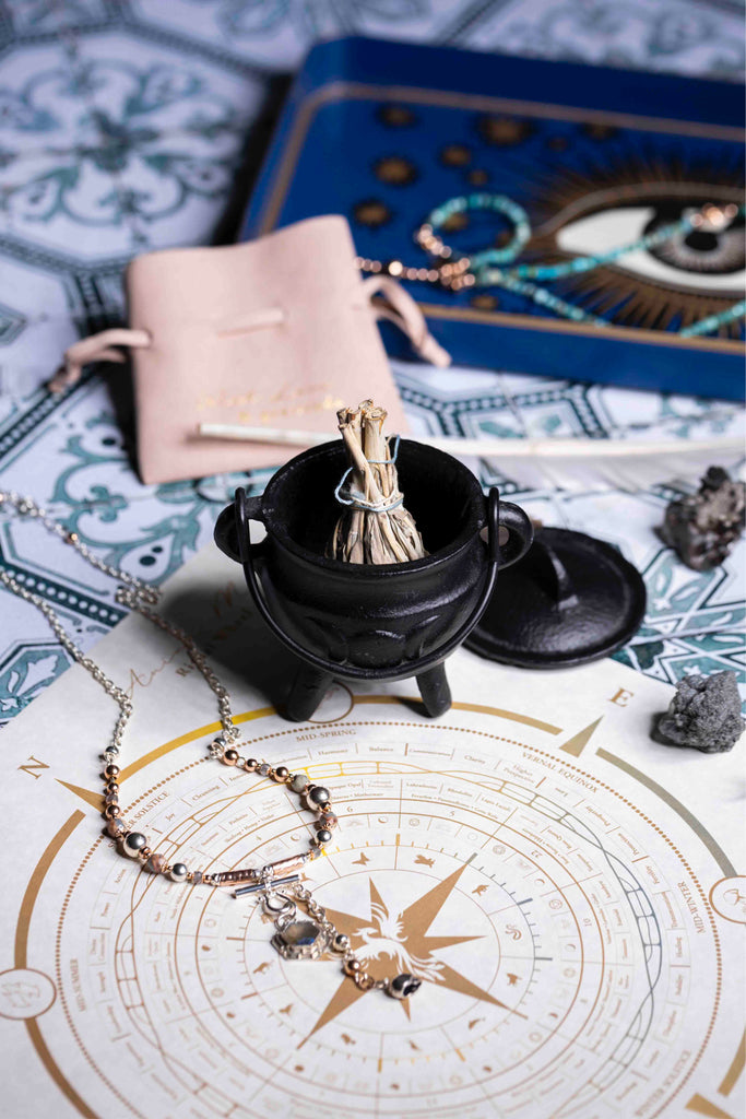 Model styling Melana bangles and necklaces with elegant outfit